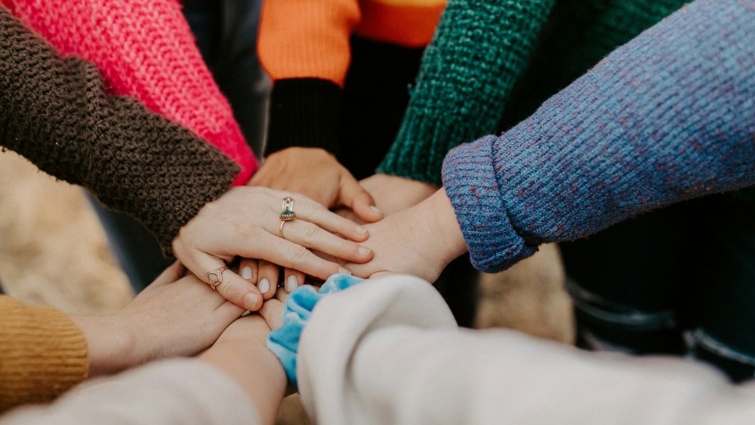 Pat Cronin Foundation - 1064x599 - Stock image Hands joining together to signify teamwork.