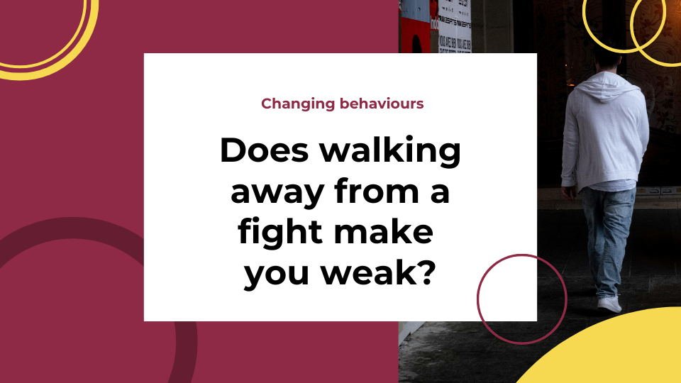 Man-in-jeans-and-cardigan-walking-away-from-camera